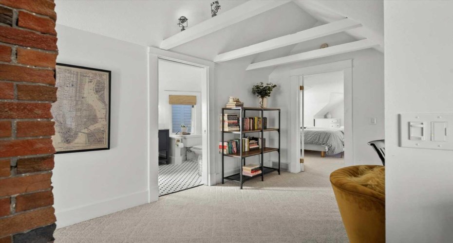 The most charming upstairs with vaulted ceilings and exposed brick.