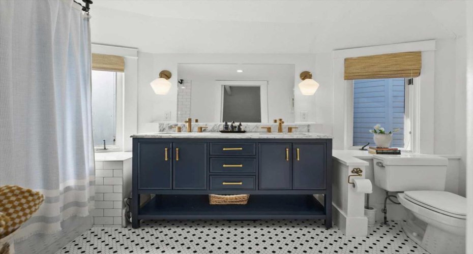 This fully remodelled bathroom is gorgeous! Featuring dual vanities.