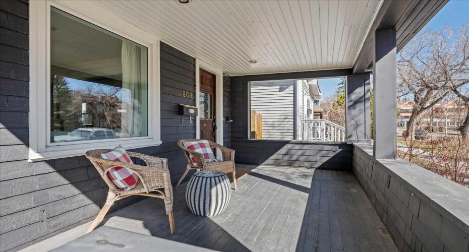 Enjoy your morning coffee on this sunny east-facing front porch.