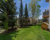 Very private well maintained yard with mature trees