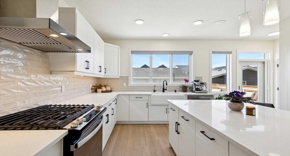 You will LOVE access to lots of counterspace & cupboards TO ACCOMMODATE ALL of your culinary masterpieces.  You will love this brightly lit kitchen!