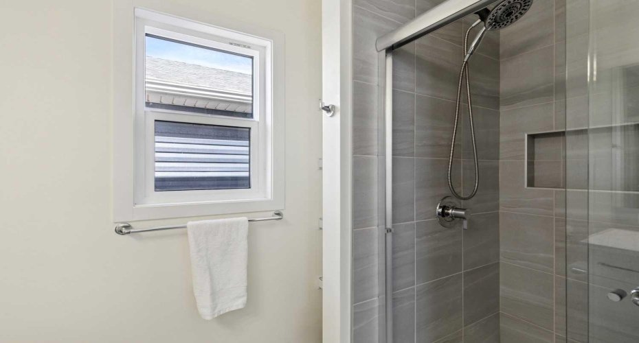 Your primary en suite complete with glass shower!