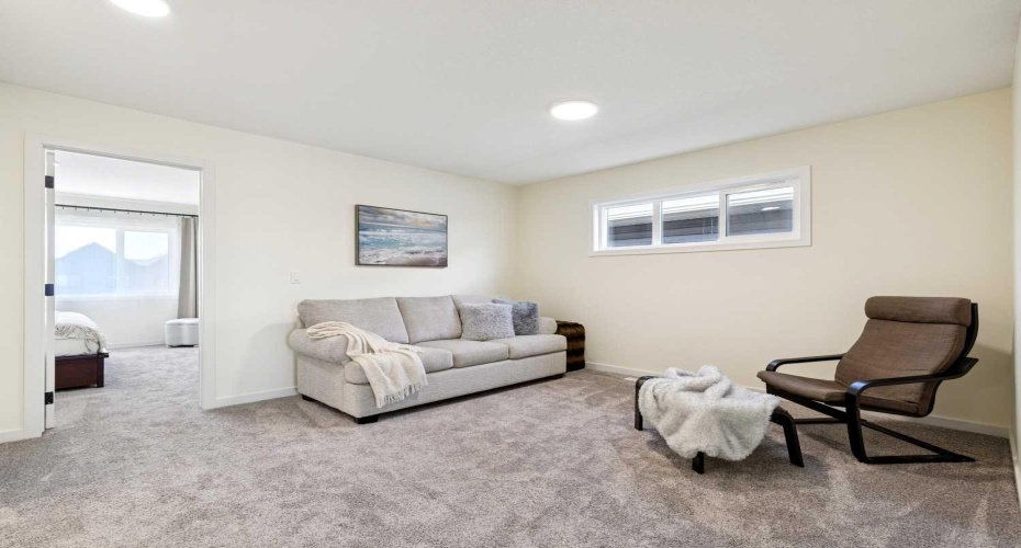 A versatile bonus room offers space for a home office, playroom, or additional media centre.