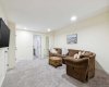 Enjoy watching Netflix whilst eating popcorn in your cozy lower level family room -- large enough to accommodate the whole family.