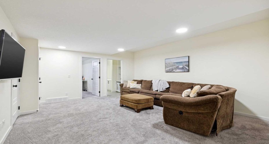 Enjoy watching Netflix whilst eating popcorn in your cozy lower level family room -- large enough to accommodate the whole family.