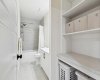 Your lower level BRIGHT 4-piece bath includes BUILT-IN SHELVING --extra storage is always a bonus!