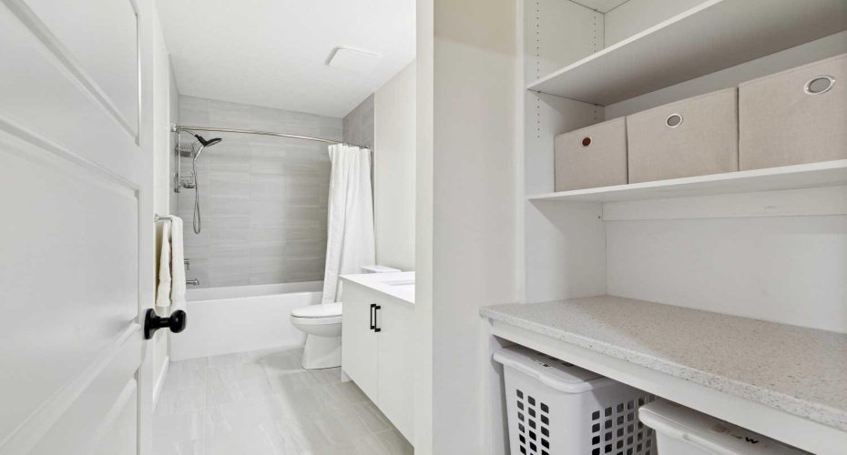 Your lower level BRIGHT 4-piece bath includes BUILT-IN SHELVING --extra storage is always a bonus!