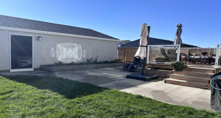 Large composite, glass and aluminum deck, large patio area, planters, and the perfect amount of green space complete with irrigation.
