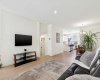 The open-concept main floor is ideal for both entertaining and everyday living, featuring 9-foot ceilings, large windows that flood the space with natural light, and a layout that effortlessly connects the kitchen, dining, and living areas.