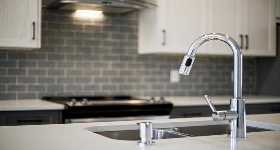 Upgraded faucets and backsplash