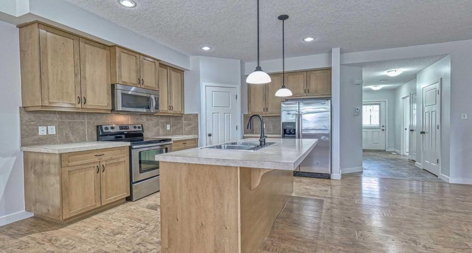 Pendant lights over the breakfast  bar