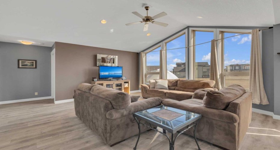 Ample space for the whole family in the generous living room. You can just see the entrance to the second upstairs bedroom here.