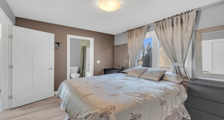 Primary bedroom with its own entrance to the 4-piece main floor bathroom.