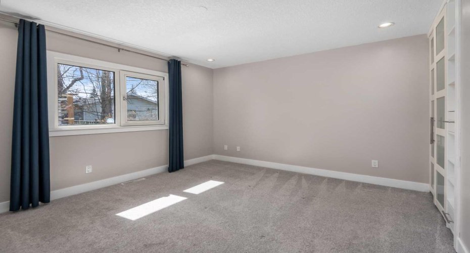 Primary bedroom with view to spectacular back yard.
