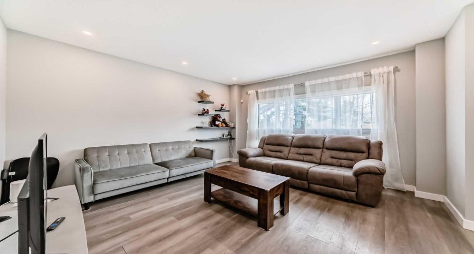Large windows /custom Hunter Douglas top-down blinds provide tons of natural light