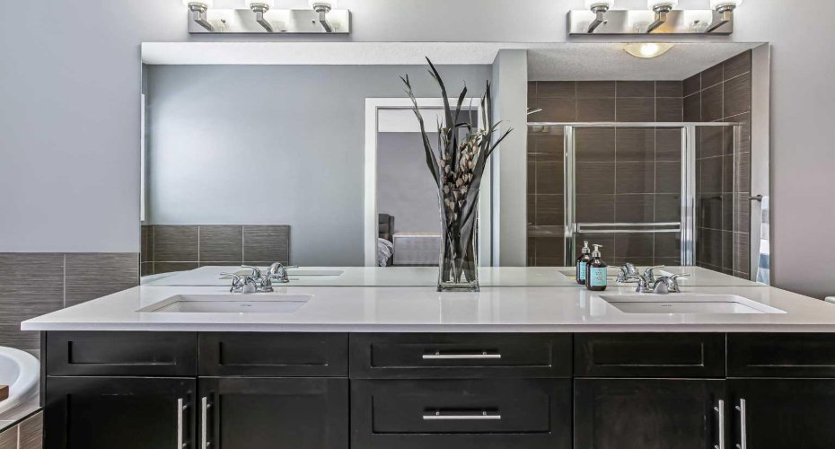 The 5 pc ensuite has dual sinks, quartz counters, deep soaker tub & large glass shower.