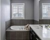 The 5 pc ensuite has dual sinks, quartz counters, deep soaker tub & large glass shower.