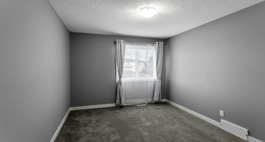 2nd upper bedroom offers ample closet space.