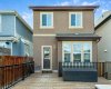 Low maintenance west-facing backyard with a large deck, gas line & oversized double detached garage (24' X 24' )