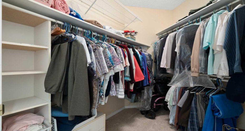 Primary bedroom, walk-in closet with organizers.