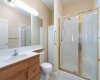 Primary bedroom, 3- piece en-suite,  walk-in shower, storage cabinet, tile flooring.