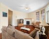 Spacious living room, 9' ceilings, cork flooring, ceiling fan.