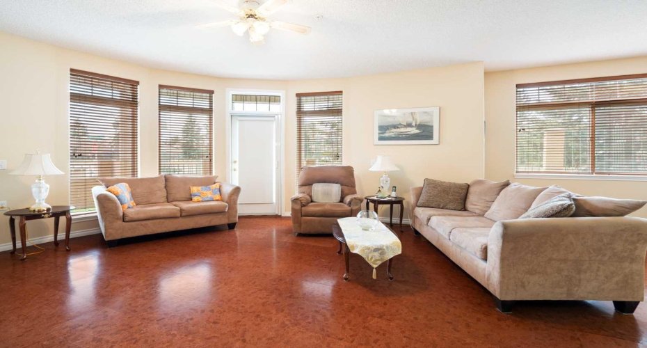 Living room with door to south wrap-around patio.