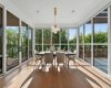 Dine with the trees in this formal dining space that connects to the covered patio area.