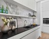 Pass through butlers pantry directly behind the kitchen.