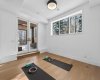 Lower level gym area with access to covered walk-out deck.