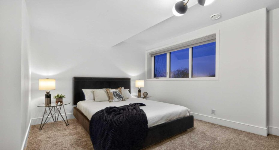 Lower level guest bedroom #2 with ensuite and walk-in closet.