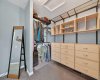 Walk in closet in the primary bedroom