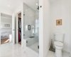 Walk-in closet and glass shower