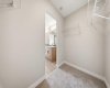 Walk-in closet in the primary bedroom offering ample storage space.