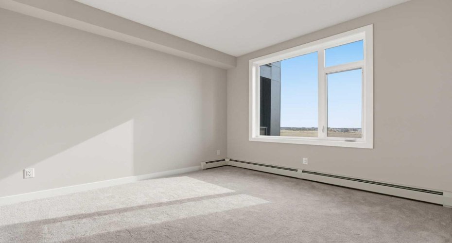 Primary bedroom shown without virtual staging.