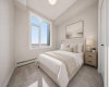 Virtually staged second bedroom—ideal for guests, a home office, or additional living space.