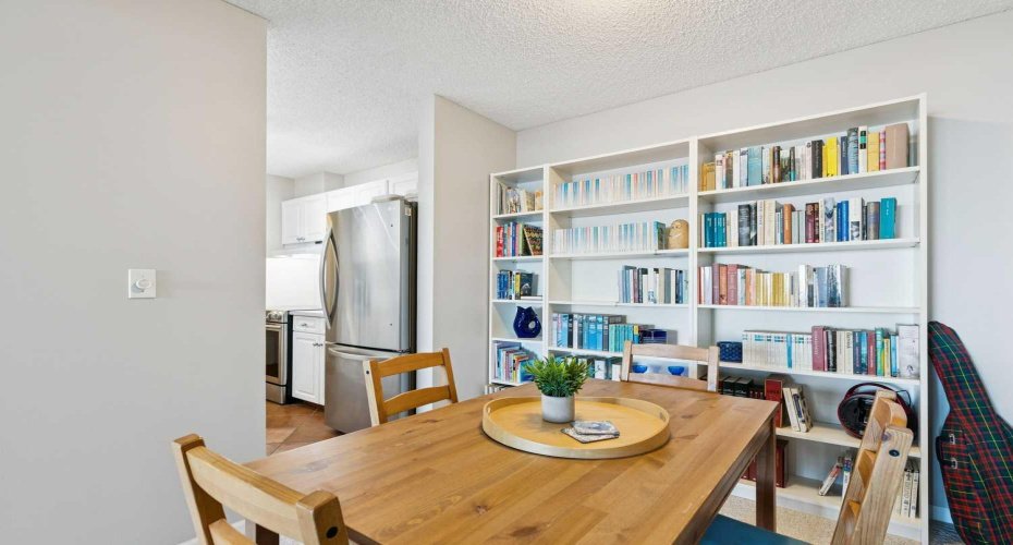 Dining area holds a 4 pc dining table.