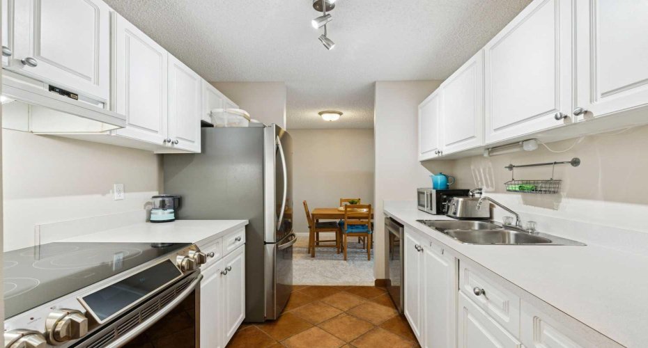 Kitchen with stainless steel appliances.