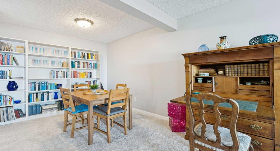 Dining area holds a 4 pc dining table.
