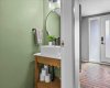 Half Bathroom - Refreshed with newer paint, fixtures, and vanity