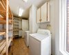 Laundry room off the kitchen with excellent storage.
