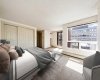 Virtually staged to showcase an alternate view of the primary bedroom & the abundance of natural light from the oversized windows.