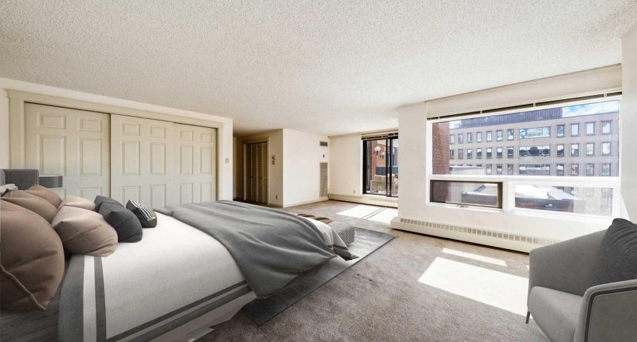 Virtually staged to showcase an alternate view of the primary bedroom & the abundance of natural light from the oversized windows.