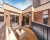 Virtually staged for inspiration, showcasing access to the second south-facing balcony.