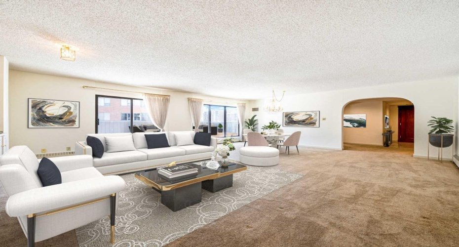 Virtually staged for inspiration, this large living & dining room offers an inviting space perfect for entertaining.