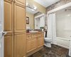 Full four piece bath with linen closet.