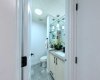 The main-floor powder room. Tucked away for privacy but easily accessible for guests, keeping the sanctuary upstairs entirely yours.