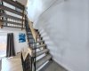 The ascent to the sanctuary. These swanky open-tread stairs are a distinct architectural feature that elevates the entire vibe of the home.