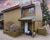 Welcome to Lakeview Green Phase 2. Your front patio, complete with massive built-in wood planters, offers a rare, communal alpine-village vibe.