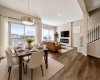 Larger windows in the South-facing rear of the house allows extra sunlight thoughout the entire main floor! -Virtually staged for illutration purposes. Decor & furniture not included.
